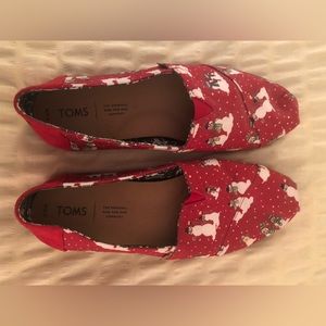 Tom’s red slip ons with snowman pattern